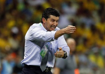 Mexico's coach Jose Manuel de la Torre gestures during their Confederations Cup Group A soccer match against Brazil at the Estadio Castelao Mexico's coach Jose Manuel de la Torre gestures during their Confederations Cup Group A soccer match against Brazil at the Estadio Castelao
