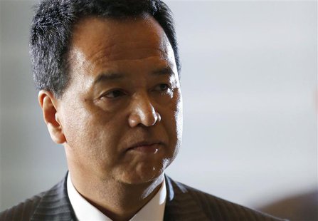 Japan's newly-appointed minister for economic revival Akira Amari arrives at Prime Minister Shinzo Abe's official residence in Tokyo Decembe Japan's newly-appointed minister for economic revival Akira Amari arrives at Prime Minister Shinzo Abe's official residence in Tokyo Decembe