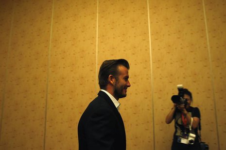 Former soccer player David Beckham arrives for a meet and greet session with students from the Guardian Academy and the Singapore Associatio Former soccer player David Beckham arrives for a meet and greet session with students from the Guardian Academy and the Singapore Associatio