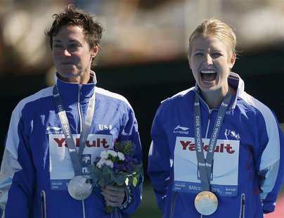 Gold medallist Cesilie Carlton of the U.S. (R) smiles next to her compatriot, silver medallist Ginger Huber, at the women's 20m high diving Gold medallist Cesilie Carlton of the U.S. (R) smiles next to her compatriot, silver medallist Ginger Huber, at the women's 20m high diving