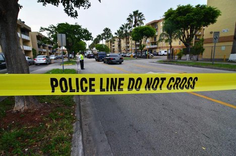 Police tape blocks the street to an apartment building after a shooting incident which began Friday evening left seven people dead in Hialea Police tape blocks the street to an apartment building after a shooting incident which began Friday evening left seven people dead in Hialea