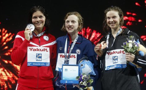 Gold medalist Katie Ledecky of the U.S. (C) poses with other medalists at the women's 1500m freestyle victory ceremony during the World Swim Gold medalist Katie Ledecky of the U.S. (C) poses with other medalists at the women's 1500m freestyle victory ceremony during the World Swim