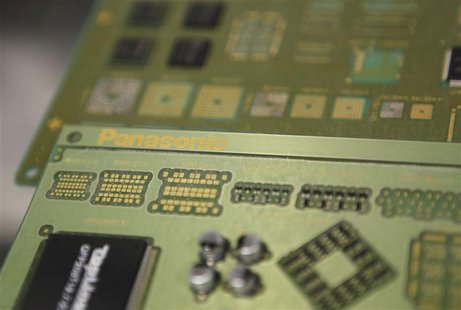 Components mounted on a circuit board by robotic chip mounter are seen at Panasonic Factory Solutions Co. in Showa town, Yamanashi prefectur Components mounted on a circuit board by robotic chip mounter are seen at Panasonic Factory Solutions Co. in Showa town, Yamanashi prefectur