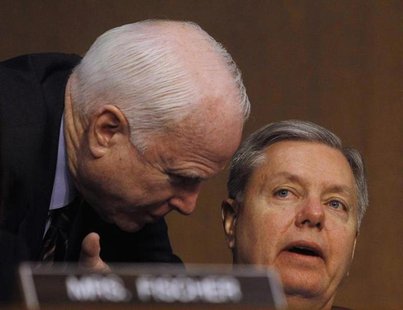 Senators John McCain (R-AZ) (L) and Lindsey Graham (R-SC) (R) confer at the Senate Armed Services Committee in Washington March 5, 2013. REU Senators John McCain (R-AZ) (L) and Lindsey Graham (R-SC) (R) confer at the Senate Armed Services Committee in Washington March 5, 2013. REU