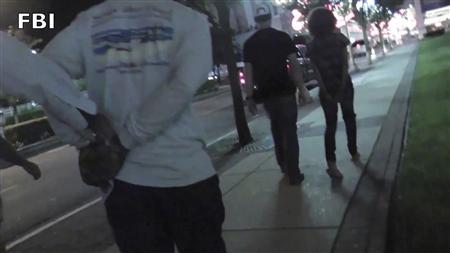 Law enforcement officers make an arrest in this still image taken from video in New Jersey, provided by the FBI July 29, 2013.
REUTERS/FBI/Handout via Reuters
Law enforcement officers make an arrest in this still image taken from video in New Jersey, provided by the FBI July 29, 2013.
REUTERS/FBI/Handout via Reuters