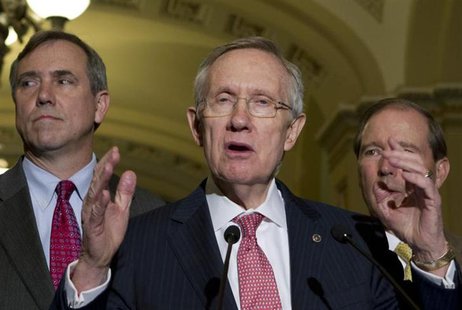 U.S. Senate Majority Leader Harry Reid, (D-NV) speaks to reporters after Senate luncheons as he is accompanied by Sen. Jeff Merkley, (D-OR) U.S. Senate Majority Leader Harry Reid, (D-NV) speaks to reporters after Senate luncheons as he is accompanied by Sen. Jeff Merkley, (D-OR)