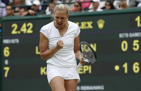 Kaia Kanepi of Estonia celebrates after defeating Laura Robson of Britain in their women's singles tennis match at the Wimbledon Tennis Cham Kaia Kanepi of Estonia celebrates after defeating Laura Robson of Britain in their women's singles tennis match at the Wimbledon Tennis Cham