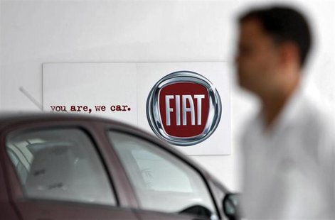 A man walks past a Fiat logo at a showroom in Noida, on the outskirts of New Delhi April 3, 2013. REUTERS/Mansi Thapliyal A man walks past a Fiat logo at a showroom in Noida, on the outskirts of New Delhi April 3, 2013. REUTERS/Mansi Thapliyal