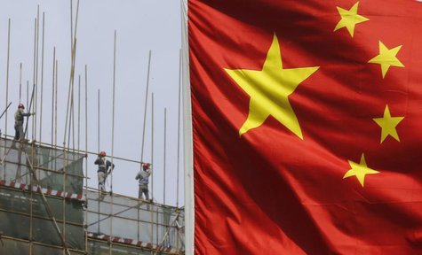 Labourers working at a construction site are pictured behind a Chinese flag in Beijing April 24, 2013. REUTERS/Kim Kyung-Hoon Labourers working at a construction site are pictured behind a Chinese flag in Beijing April 24, 2013. REUTERS/Kim Kyung-Hoon