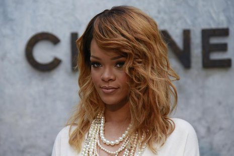 Singer Rihanna poses during a photocall before the Haute Couture Fall Winter 2013/2014 fashion show by German designer Karl Lagerfeld for Fr Singer Rihanna poses during a photocall before the Haute Couture Fall Winter 2013/2014 fashion show by German designer Karl Lagerfeld for Fr