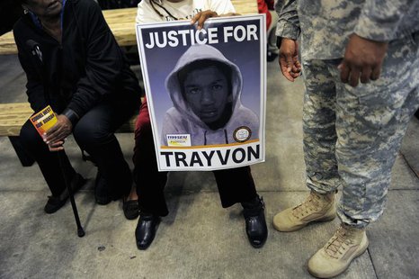 Supporters gather to join a candlelight vigil at the exact moment when teenager Trayvon Martin was shot one year ago by neighborhood watch v Supporters gather to join a candlelight vigil at the exact moment when teenager Trayvon Martin was shot one year ago by neighborhood watch v