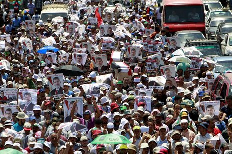 Supporters of deposed Egyptian President Mohamed Mursi shout slogans and hold symbolic coffins during a march from the Al-Fath Mosque to the Supporters of deposed Egyptian President Mohamed Mursi shout slogans and hold symbolic coffins during a march from the Al-Fath Mosque to the