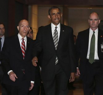 U.S. President Barack Obama (C) arrives for a meeting with House Democrats at the Capitol Visitor's Center in Washington July 31, 2013. REUT U.S. President Barack Obama (C) arrives for a meeting with House Democrats at the Capitol Visitor's Center in Washington July 31, 2013. REUT