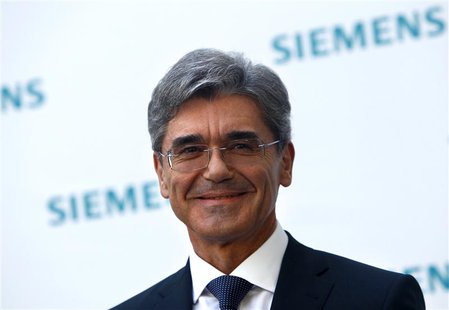 Newly elected Siemens CEO Joe Kaeser arrives for a news conference in Germany's Siemens AG headquarter in Munich July 31, 2013. REUTERS/Mich Newly elected Siemens CEO Joe Kaeser arrives for a news conference in Germany's Siemens AG headquarter in Munich July 31, 2013. REUTERS/Mich