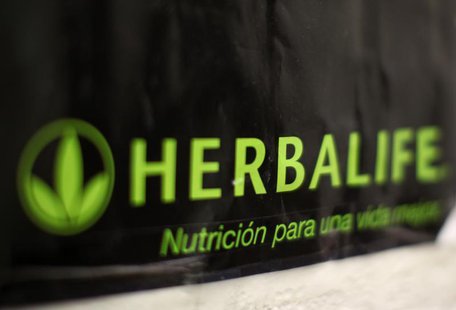 An Herbalife logo is shown on a poster at a clinic in the Mission District in San Francisco, California April 29, 2013. REUTERS/Robert Galbr An Herbalife logo is shown on a poster at a clinic in the Mission District in San Francisco, California April 29, 2013. REUTERS/Robert Galbr