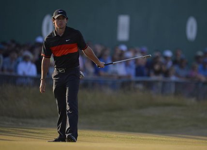 Rory McIlroy of Northern Ireland watches his putt on the 18th green during his second round of the British Open golf Championship at Muirfie Rory McIlroy of Northern Ireland watches his putt on the 18th green during his second round of the British Open golf Championship at Muirfie