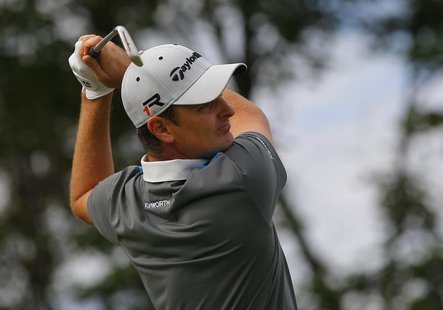 Justin Rose of England watches his tee shot on the second hole during the first round of the British Open golf Championship at Muirfield in Justin Rose of England watches his tee shot on the second hole during the first round of the British Open golf Championship at Muirfield in