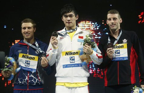 Gold medalist Sun Yang (C) of China poses with silver medalist Michael McBroom (L) of the U.S. and bronze medalist Ryan Cochrane of Canada a Gold medalist Sun Yang (C) of China poses with silver medalist Michael McBroom (L) of the U.S. and bronze medalist Ryan Cochrane of Canada a