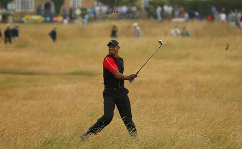 Tiger Woods of the U.S. hits out of the rough on the tenth hole during the final round of the British Open golf championship at Muirfield in Tiger Woods of the U.S. hits out of the rough on the tenth hole during the final round of the British Open golf championship at Muirfield in