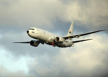 A P-8A Poseidon surveillance plane conducts flyovers above the Enterprise Carrier Strike Group on February 3, 2012 in this handout photo cou A P-8A Poseidon surveillance plane conducts flyovers above the Enterprise Carrier Strike Group on February 3, 2012 in this handout photo cou