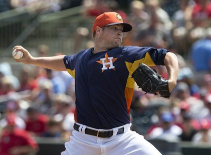 Houston Astros starting pitcher Bud Norris works from the mound against the St. Louis Cardinals during the first inning of their MLB spring Houston Astros starting pitcher Bud Norris works from the mound against the St. Louis Cardinals during the first inning of their MLB spring