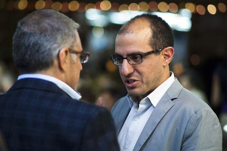 New York City Mayoral candidate Jack Hidary (R ) speaks with a resident as he attends a fundraiser in Staten Island, New York, in this file New York City Mayoral candidate Jack Hidary (R ) speaks with a resident as he attends a fundraiser in Staten Island, New York, in this file