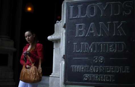 A woman leaves a branch of Lloyds Bank in the city of London August 1, 2013. REUTERS/Andrew Winning A woman leaves a branch of Lloyds Bank in the city of London August 1, 2013. REUTERS/Andrew Winning