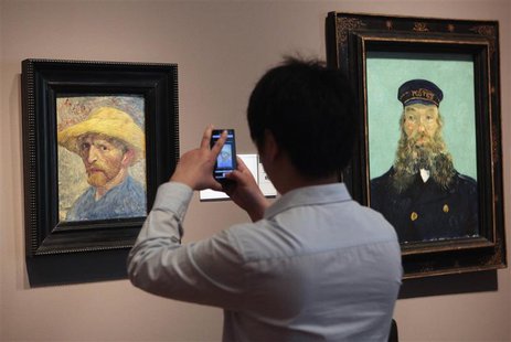 A visitor uses his cell phone to take a picture of the 'Self Portrait' painting by painter Vincent van Gogh at the Detroit Institute of Arts A visitor uses his cell phone to take a picture of the 'Self Portrait' painting by painter Vincent van Gogh at the Detroit Institute of Arts