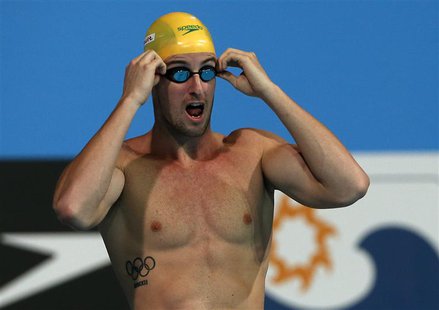 Australia's James Magnussen adjusts his goggles as he prepares for his men's 100m freestyle semi-final during the World Swimming Championshi Australia's James Magnussen adjusts his goggles as he prepares for his men's 100m freestyle semi-final during the World Swimming Championshi