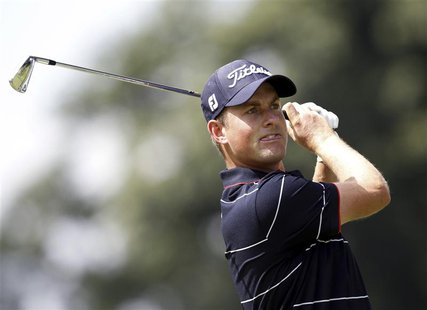Webb Simpson of the U.S. watches his tee shot on the 15th hole during the first round of the WGC-Bridgestone Invitational golf tournament in Webb Simpson of the U.S. watches his tee shot on the 15th hole during the first round of the WGC-Bridgestone Invitational golf tournament in