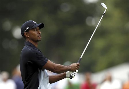 Tiger Woods of the U.S. watches his second shot on the 13th hole during the first round of the WGC-Bridgestone Invitational golf tournament Tiger Woods of the U.S. watches his second shot on the 13th hole during the first round of the WGC-Bridgestone Invitational golf tournament