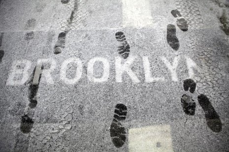 A sign is seen covered in snow on the Brooklyn Bridge in New York February 10, 2010. REUTERS/Natalie Behring A sign is seen covered in snow on the Brooklyn Bridge in New York February 10, 2010. REUTERS/Natalie Behring