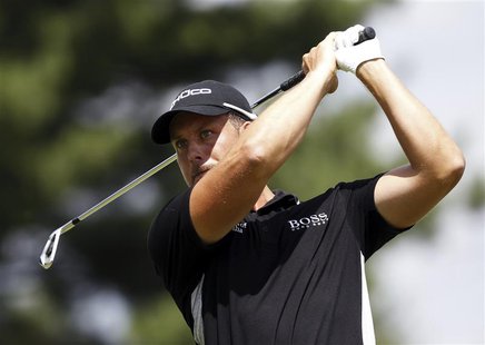 Henrik Stenson of Sweden watches his tee shot on the 17th hole during the first round of the WGC-Bridgestone Invitational golf tournament in Henrik Stenson of Sweden watches his tee shot on the 17th hole during the first round of the WGC-Bridgestone Invitational golf tournament in