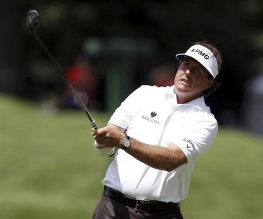 Phil Mickelson of the U.S. watches his second shot on the second hole during the first round of the WGC-Bridgestone Invitational golf tourna Phil Mickelson of the U.S. watches his second shot on the second hole during the first round of the WGC-Bridgestone Invitational golf tourna