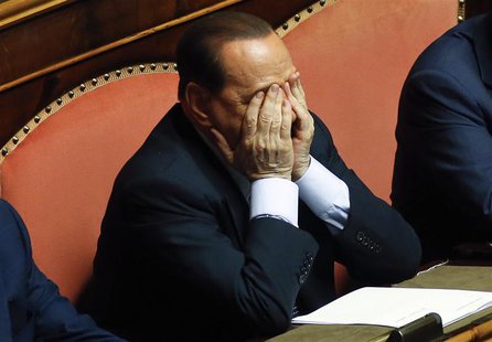 Former Italian Prime Minister Silvio Berlusconi reacts during a vote session at the Senate in Rome in this July 19, 2013 file photo. REUTERS Former Italian Prime Minister Silvio Berlusconi reacts during a vote session at the Senate in Rome in this July 19, 2013 file photo. REUTERS