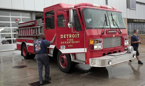 Detroit firefighters park their ladder truck in front of their southwest Detroit fire house in Detroit, Michigan July 23, 2013. REUTERS/ Reb Detroit firefighters park their ladder truck in front of their southwest Detroit fire house in Detroit, Michigan July 23, 2013. REUTERS/ Reb
