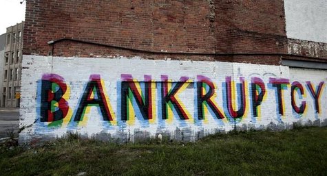 The word 'Bankruptcy' is seen painted on the side of a vacant building by street artists as a statement on the financial affairs of the city The word 'Bankruptcy' is seen painted on the side of a vacant building by street artists as a statement on the financial affairs of the city