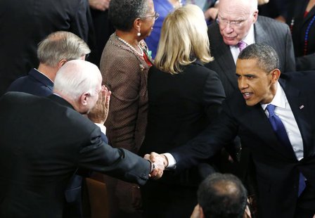 U.S. President Barack Obama (R) shakes hands with U.S. Sen. John McCain (R-AZ) as he arrives to deliver his State of the Union Speech on Cap U.S. President Barack Obama (R) shakes hands with U.S. Sen. John McCain (R-AZ) as he arrives to deliver his State of the Union Speech on Cap
