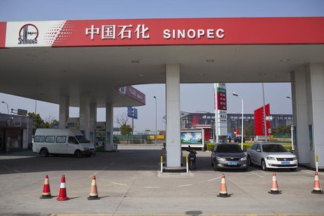 Cars are seen parked at a Sinopec gas station in Shanghai, March 18, 2013. REUTERS/Aly Song Cars are seen parked at a Sinopec gas station in Shanghai, March 18, 2013. REUTERS/Aly Song