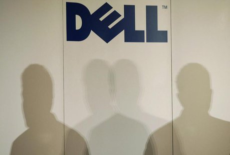 Shadows of Michael Dell, chairman of the board and chief executive officer of Dell, are cast under the company logo as he speaks during a pr Shadows of Michael Dell, chairman of the board and chief executive officer of Dell, are cast under the company logo as he speaks during a pr