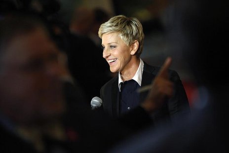 Ellen DeGeneres smiles as she talks to a reporter while arriving for the Mark Twain Prize ceremony in Washington, October 22, 2012. REUTERS/ Ellen DeGeneres smiles as she talks to a reporter while arriving for the Mark Twain Prize ceremony in Washington, October 22, 2012. REUTERS/