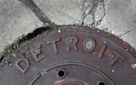 'Detroit' is seen on the top of an iron man-hole cover on a street in Detroit, Michigan July 27, 2013. REUTERS/ Rebecca Cook 'Detroit' is seen on the top of an iron man-hole cover on a street in Detroit, Michigan July 27, 2013. REUTERS/ Rebecca Cook
