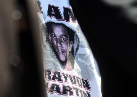 A supporter of the late Trayvon Martin wears a t-shirt bearing his likeness outside a meeting on Florida's 'Stand Your Ground' law in Longwo A supporter of the late Trayvon Martin wears a t-shirt bearing his likeness outside a meeting on Florida's 'Stand Your Ground' law in Longwo