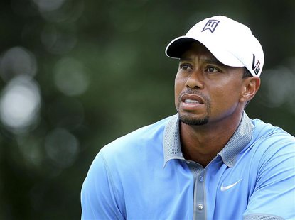 Tiger Woods of the United States watches his tee shot on the 14th hole during the second round of the WGC-Bridgestone Invitational golf tour Tiger Woods of the United States watches his tee shot on the 14th hole during the second round of the WGC-Bridgestone Invitational golf tour