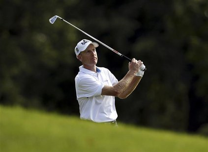 Jim Furyk of the U.S. watches his second shot on the ninth hole during the first round of the WGC-Bridgestone Invitational golf tournament i Jim Furyk of the U.S. watches his second shot on the ninth hole during the first round of the WGC-Bridgestone Invitational golf tournament i