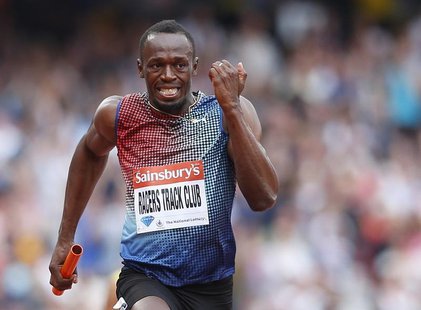 Usain Bolt of Jamaica approaches the finish line after running the final leg for the Racers Track Club to win in the men's 4x100m relay at t Usain Bolt of Jamaica approaches the finish line after running the final leg for the Racers Track Club to win in the men's 4x100m relay at t