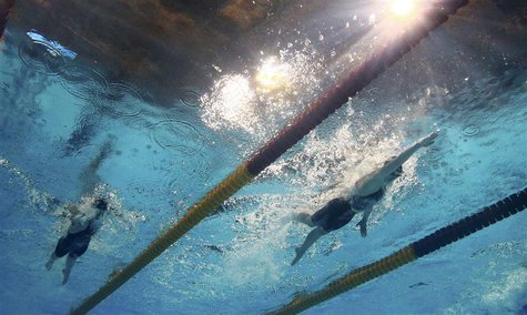 Katie Ledecky of the U.S. (R) is seen underwater as she swims to a new world record in the women's 800m freestyle final during the World Swi Katie Ledecky of the U.S. (R) is seen underwater as she swims to a new world record in the women's 800m freestyle final during the World Swi