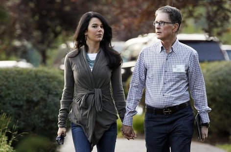 Boston Red Sox owner John Henry (R) with wife Linda Pizzuti arrives for the first session of annual Allen and Co. conference at the Sun Vall Boston Red Sox owner John Henry (R) with wife Linda Pizzuti arrives for the first session of annual Allen and Co. conference at the Sun Vall