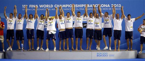 Gold medallists team Hungary celebrate on the podium during the victory ceremony after winning the men's water polo gold medal match in the Gold medallists team Hungary celebrate on the podium during the victory ceremony after winning the men's water polo gold medal match in the