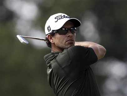 Adam Scott of Australia watches his tee shot on the 15th hole during the first round of the WGC-Bridgestone Invitational golf tournament in Adam Scott of Australia watches his tee shot on the 15th hole during the first round of the WGC-Bridgestone Invitational golf tournament in